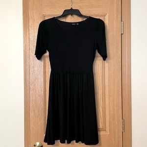 CUTE little black knit dress. Short sleeves and above the knee length